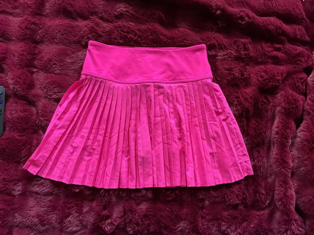 Fabletics Hot Shot Pleated Mini Skirt in Dragonfruit